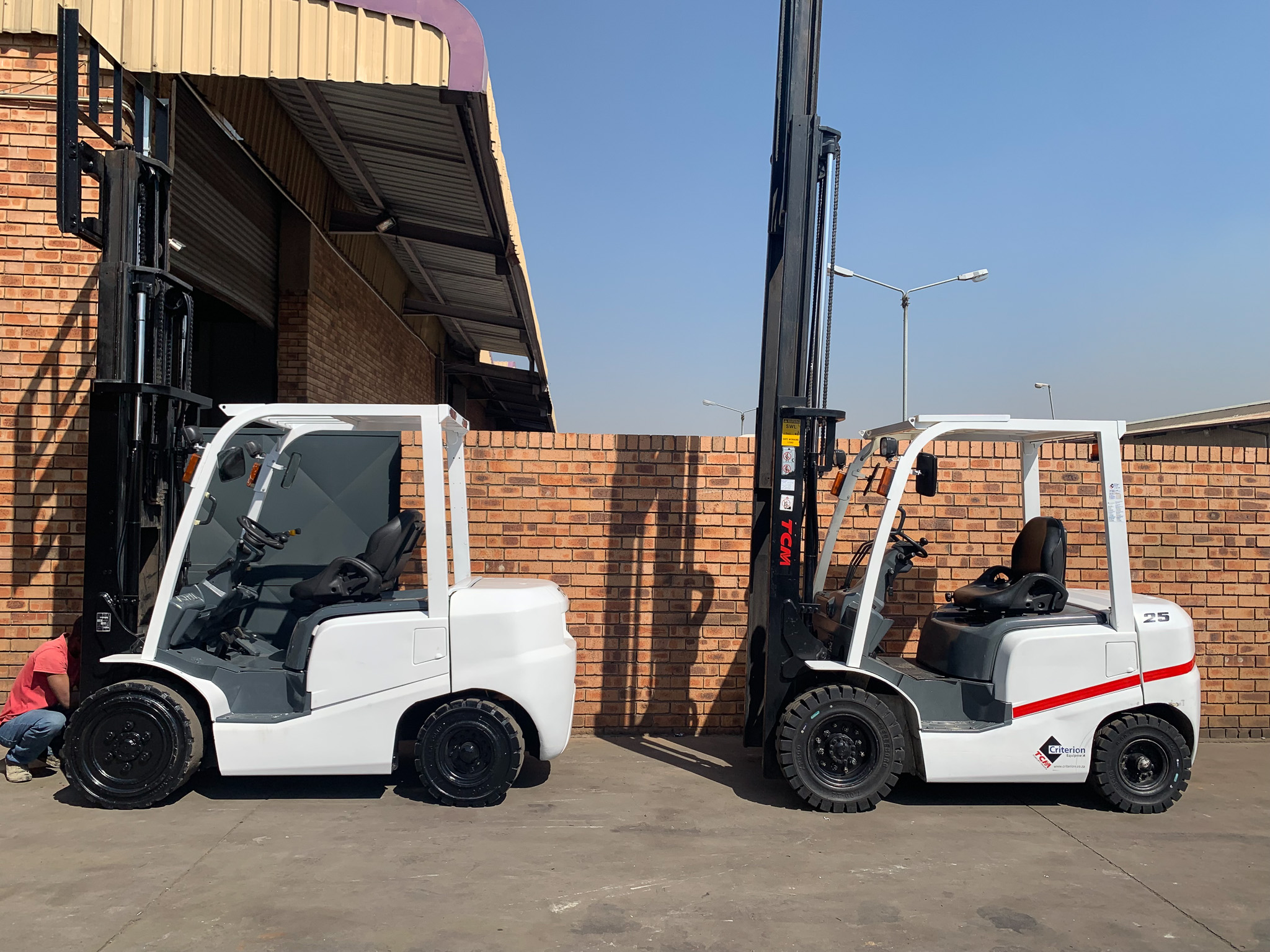 white forklifts side view